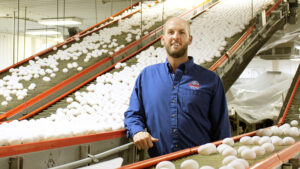 Trey Braswell in an egg production facility