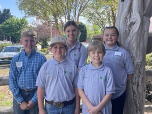 A group of children pose together.